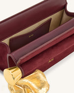 Holly フェイクスエード メタルチャーム付きクラッチ - 赤茶色